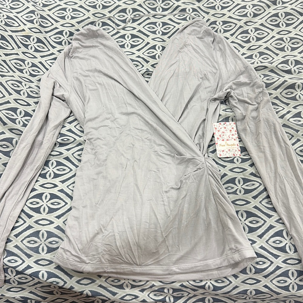 Beautiful free people blouse v line front and back. New with tag.